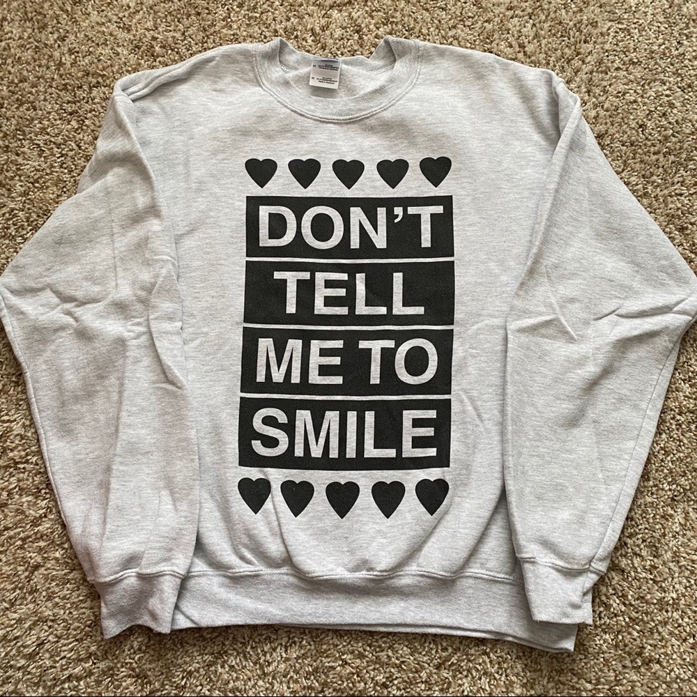 Don’t tell me to smile sweatshirt